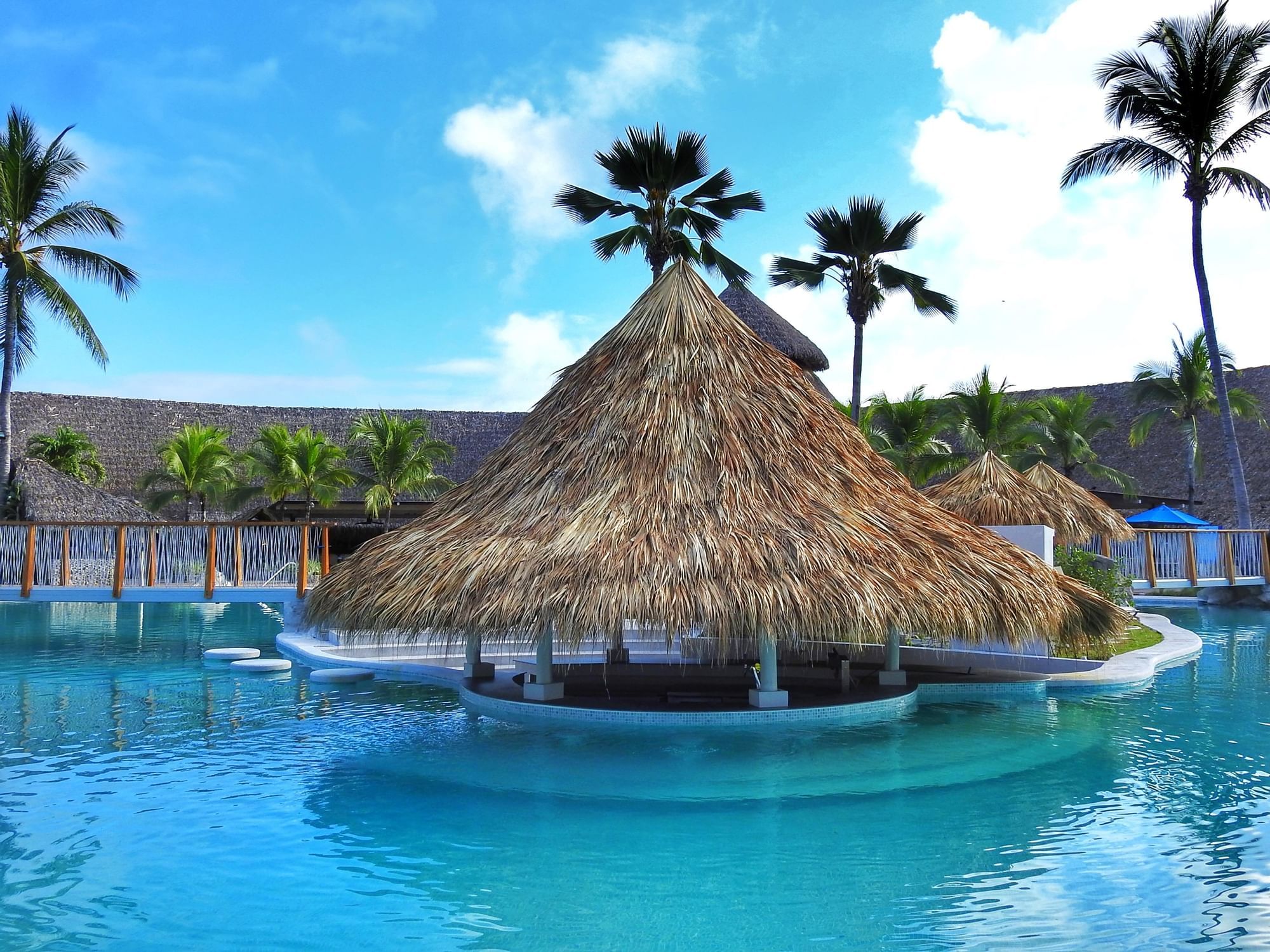 El Pargo Aquatic Bar with a large outdoor pool at Fiesta Resort