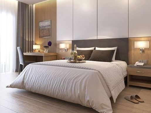Luxury bed and working desk in Room at Eastin Hotels