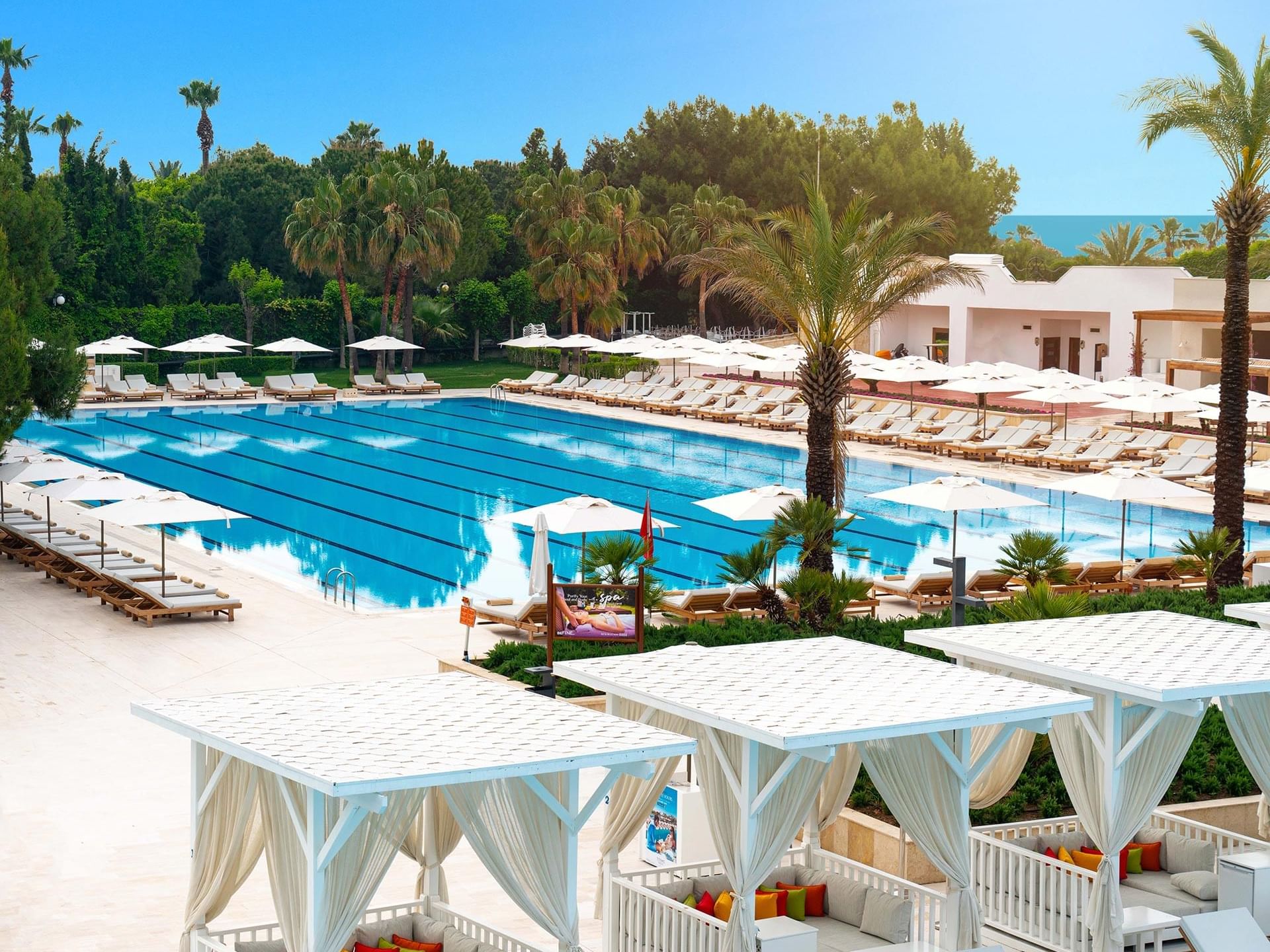 High-angle view of sun loungers arranged around the Olympic Pool at Titanic Deluxe Lara