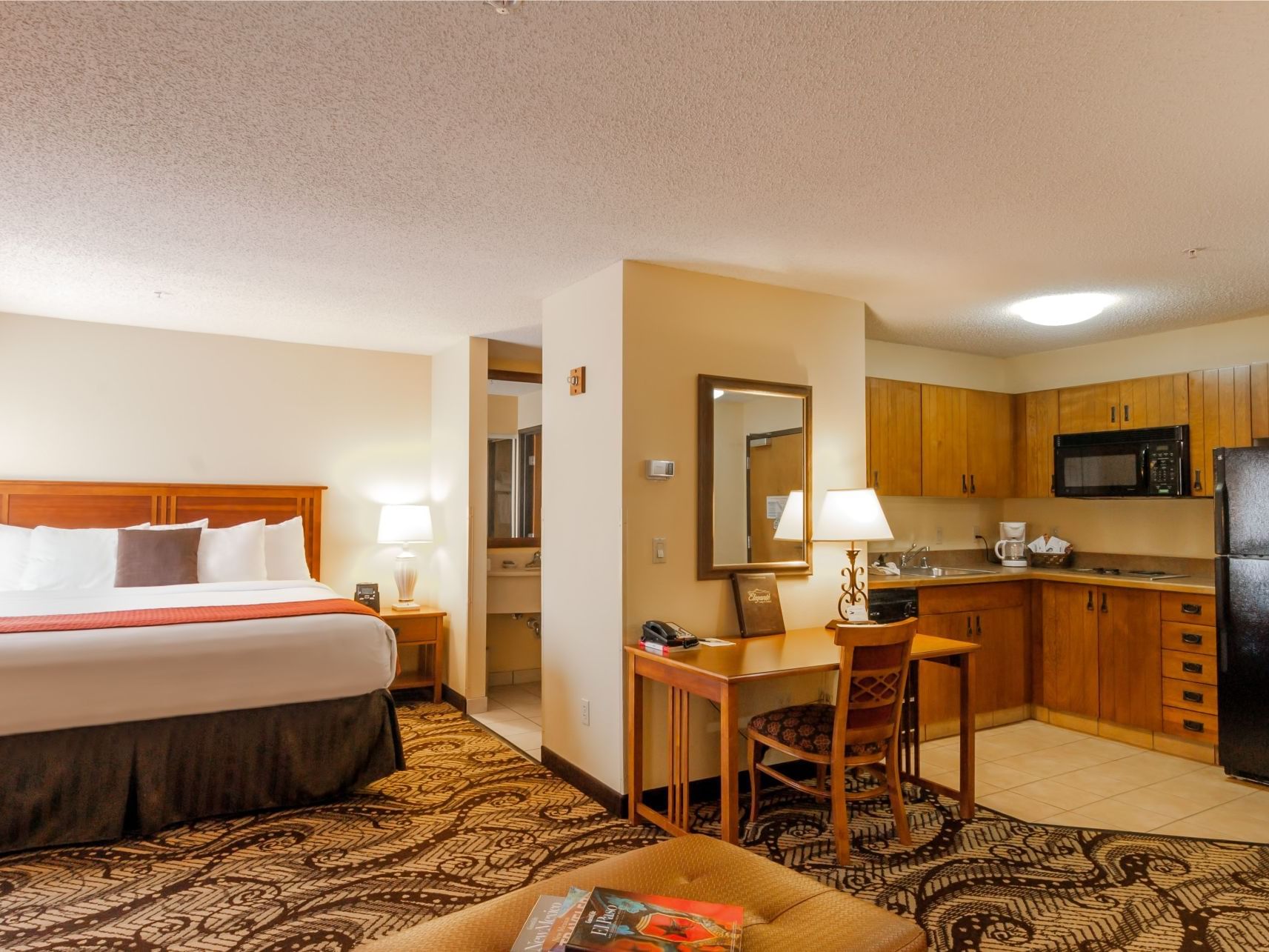 King Studio Suite bedroom & kitchen at Elegante Lodge & Resort