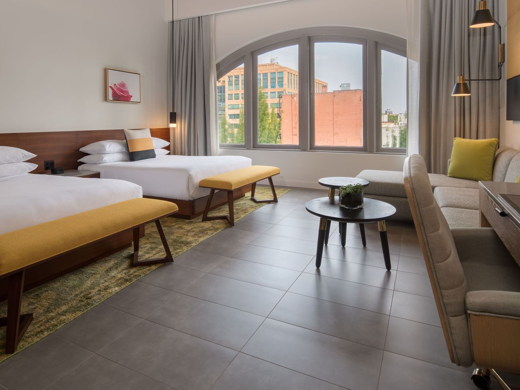 Hi-Lo hotel room with two beds and sectional sofa