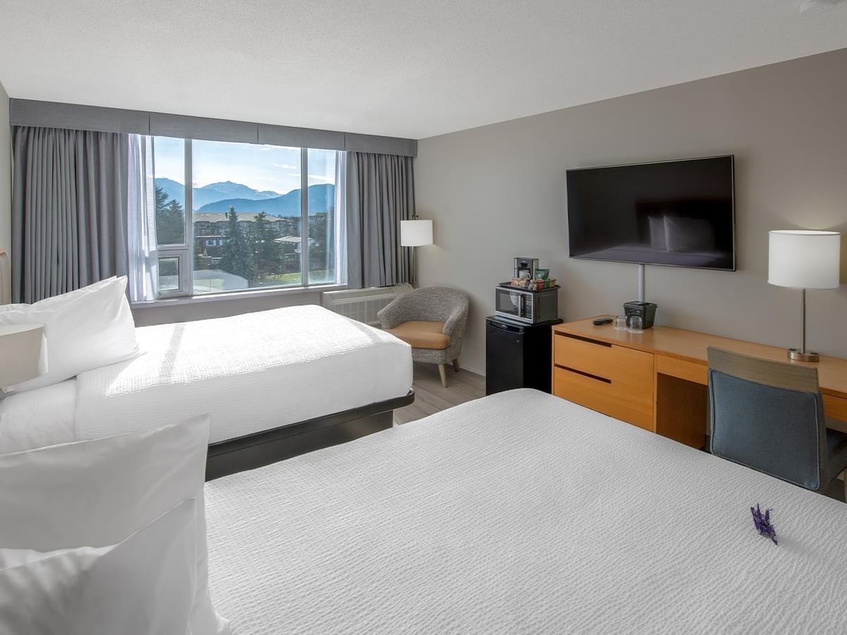 Two queen beds at a hotel room