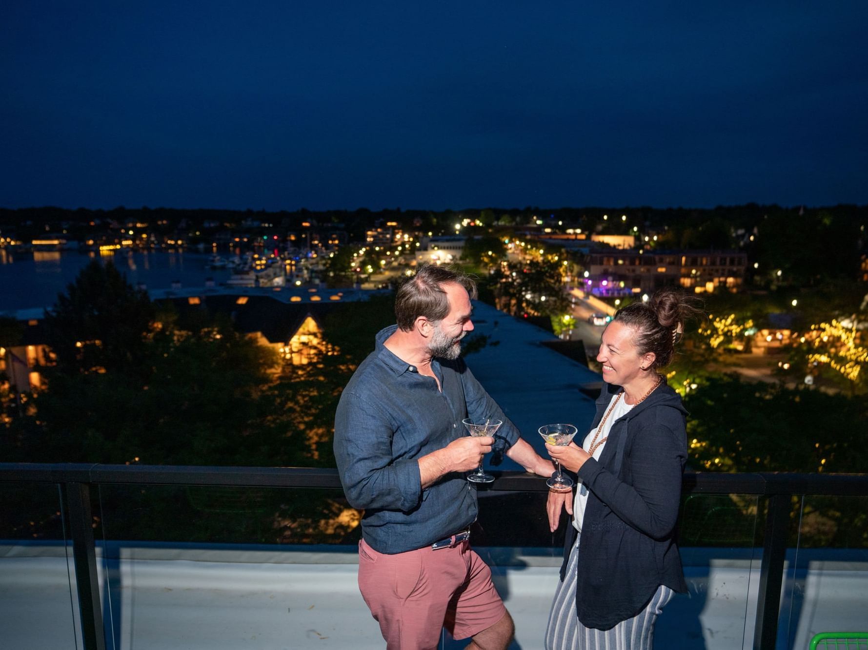 Couple enjoying drinks on the rooftop bar at The Earl