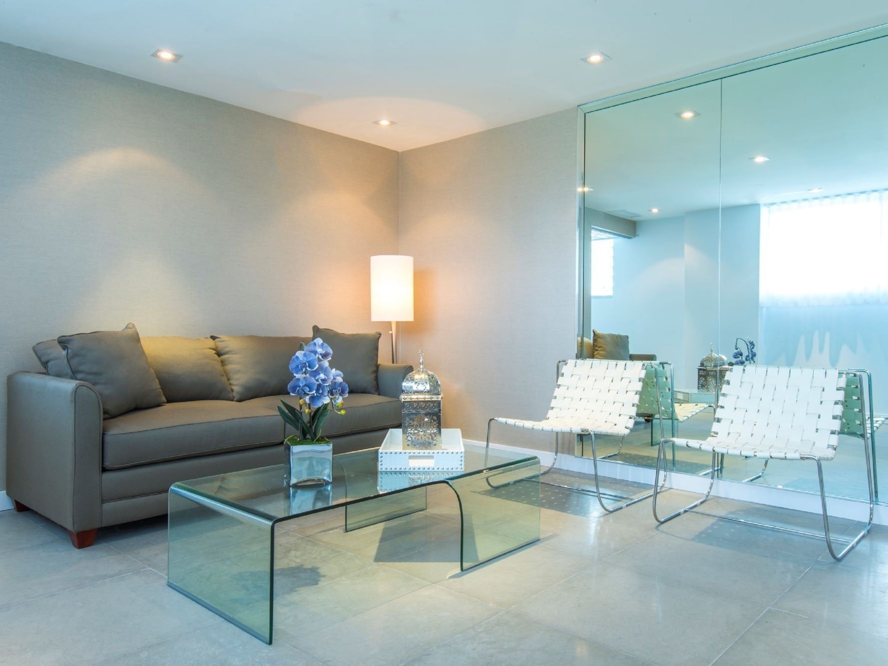 Living room with grey sofa of King Studio at Boulan South Beach