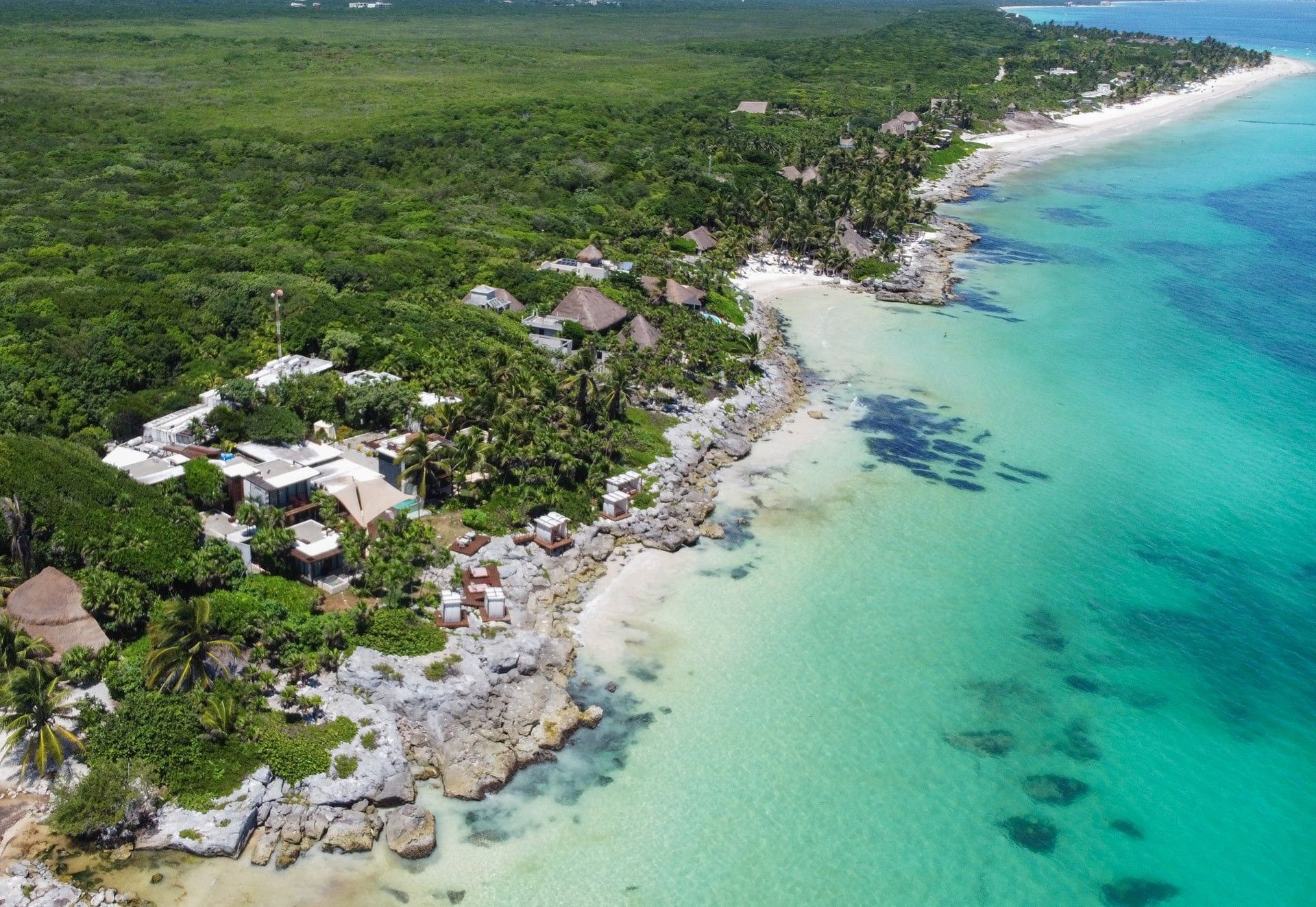 Aerial view of Mi Amor between tropical jungle and the Caribbean Sea