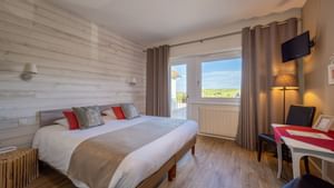 Bedroom interior of Hotel Kastelberg of The Originals Hotels