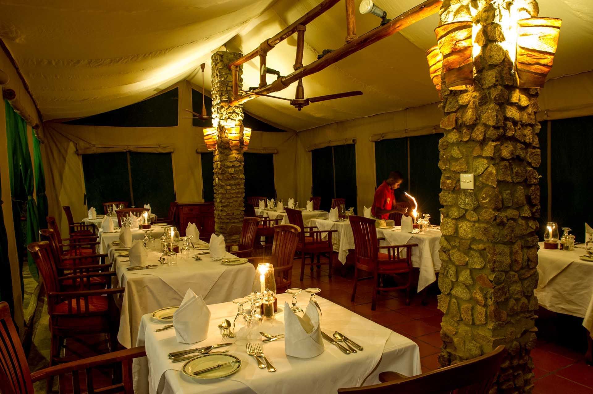 Dining tables at Dining room and bar at Mbuzi Mawe Serena Camp
