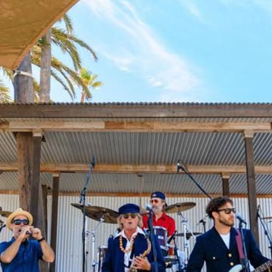 A band performing on an outdoor stage at Catalina Island Company