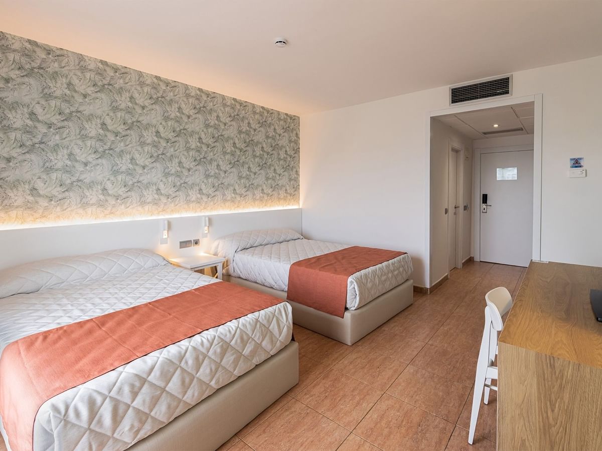 Two comfy beds with wall art in Standard Room at Ponient Pirámide Salou