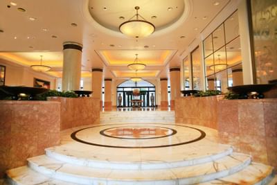 Main entrance with a chandelier at Hanoi Daewoo Hotel