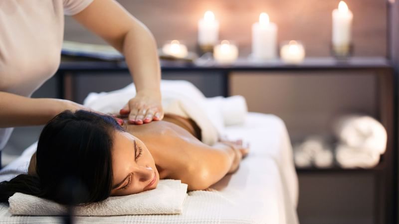 A lady having a massage in the spa at Warwick Riyadh