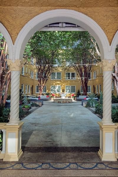 Archway leading to a courtyard area at Artmore Hotel