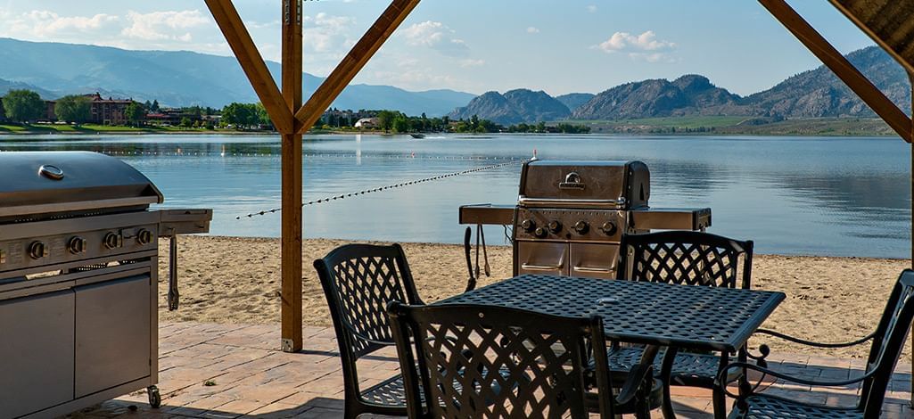 Coast Osoyoos Beach Hotel beach BBQ and table with chairs