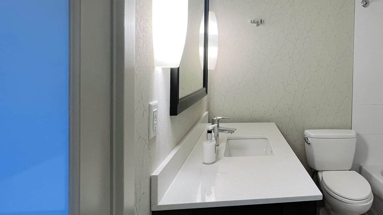 Bathroom with sink, mirror and toilet