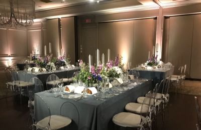 Dining table set-up in a wedding hall at Ethan Allen Hotel