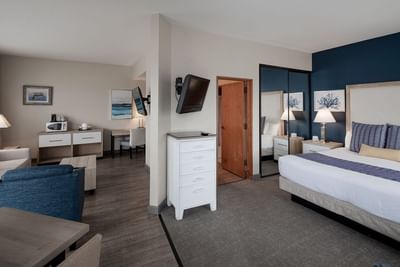 One Bedroom Suite bedroom & living room area at Bay Club Hotel