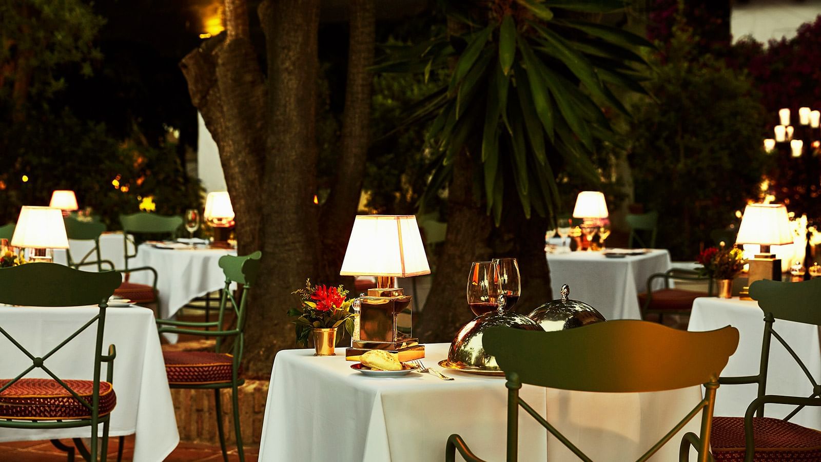 Outdoor dining table setup in The Grill at Marbella Club