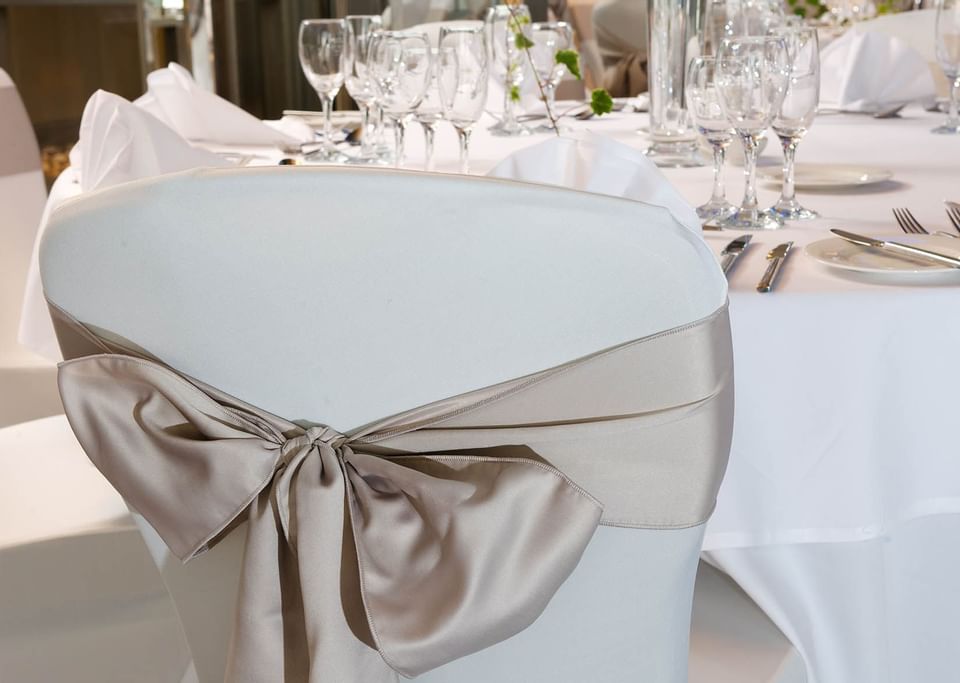 Close up on a ribbon deco on a chair at The View Eastbourne wedding