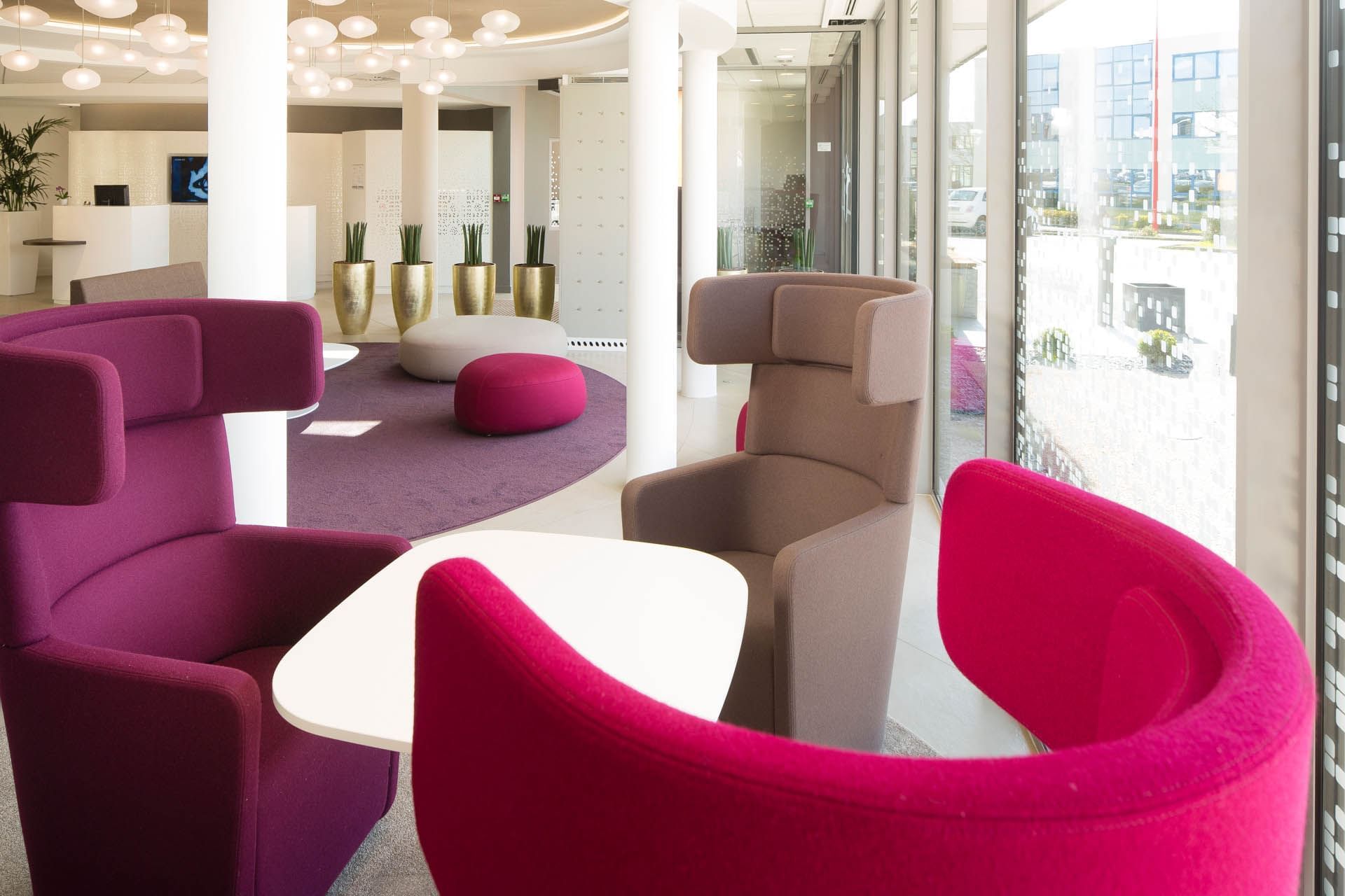 Lobby lounge with cozy sofas at Oceania Rennes