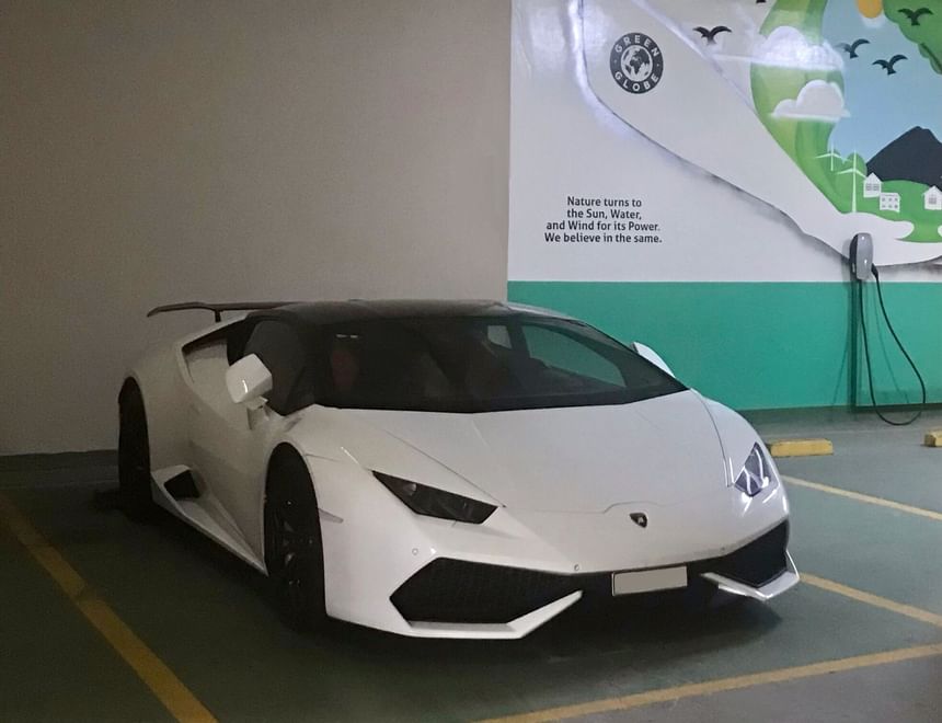 A luxury car parked in parking area at 2 Seasons Hotel & Apt 