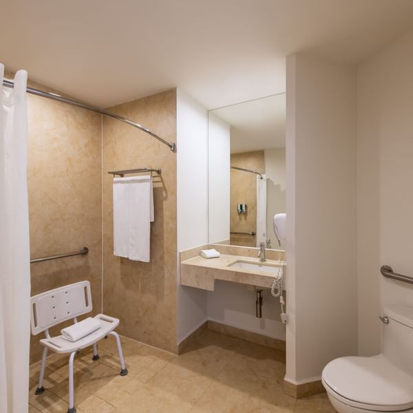 Bathroom with mirror & wash basin at One Hotels