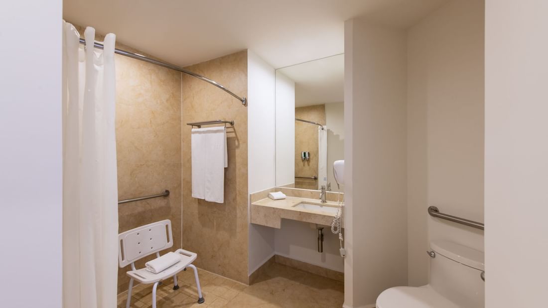 Bathroom with mirror & wash basin at One Hotels