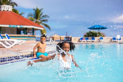 Kids playing in the outdoor pool at Holiday Inn Montego Bay