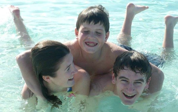Kids enjoying in the pool at The Somerset on Grace Bay