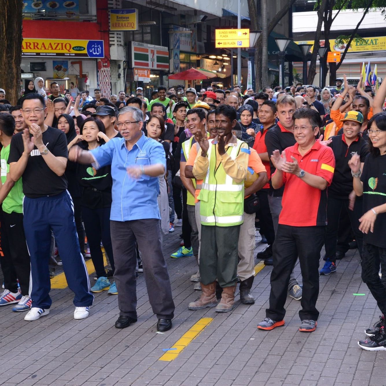 People applauding during campaign near The Federal Kuala Lumpur
