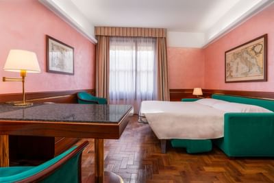 Comfy bed, work desk & lamps in Executive Suite at Hotel Crivi's in Milan
