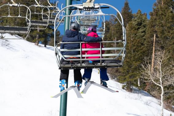 A couple on a mountain stroller near Stein Eriksen Residences