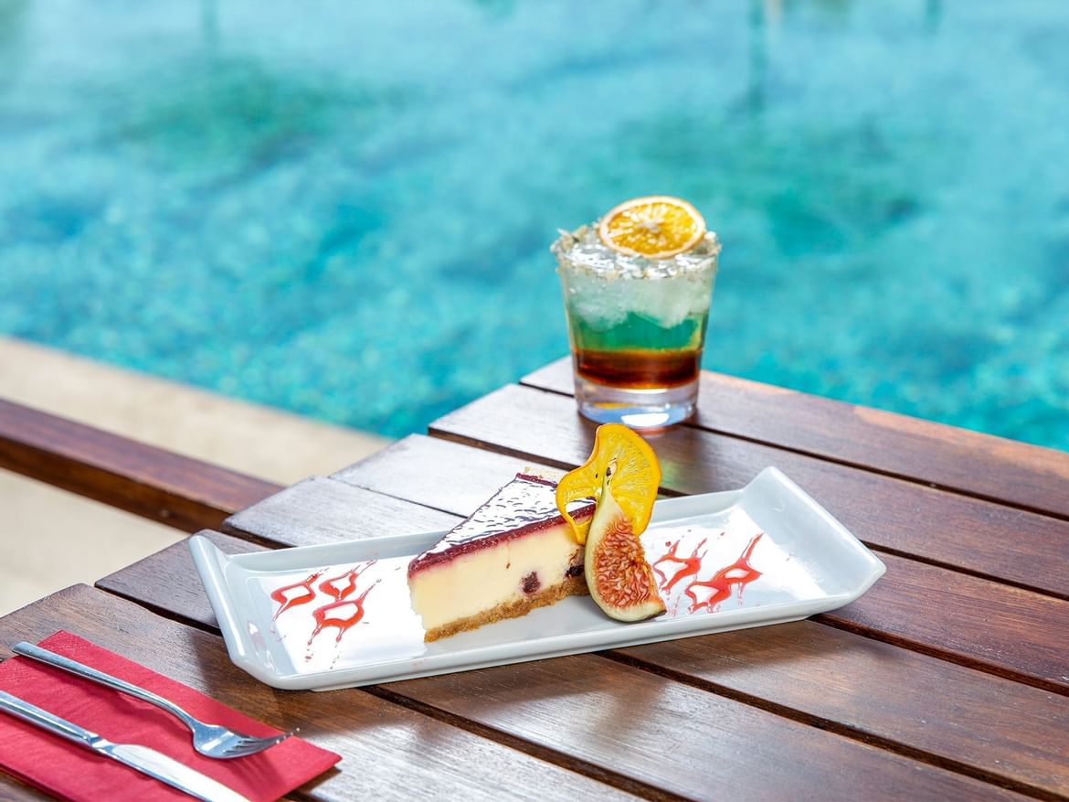 Cocktail & slice of cake on a table in Coco Bar at Senses Hotel