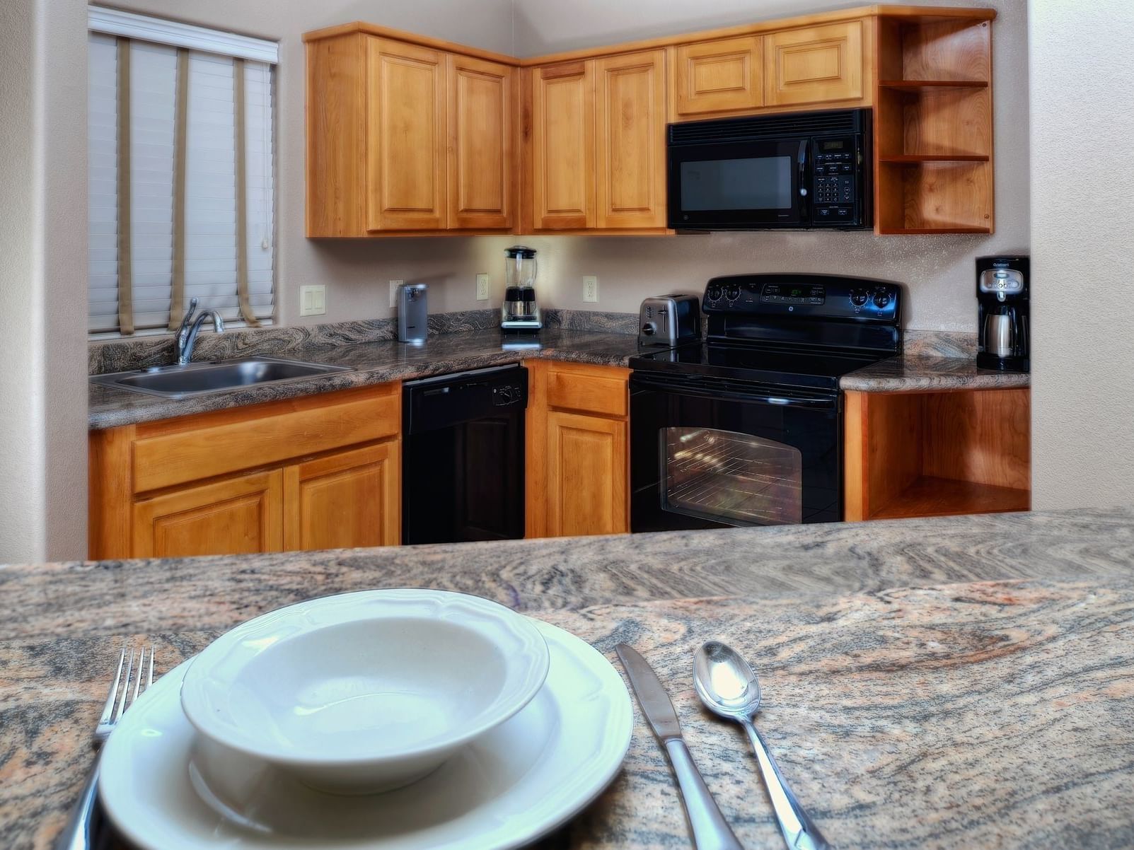 Kitchen area and necessary kitchen utensils of One Bedroom Suite at Diamond Sedona Portal Hotel