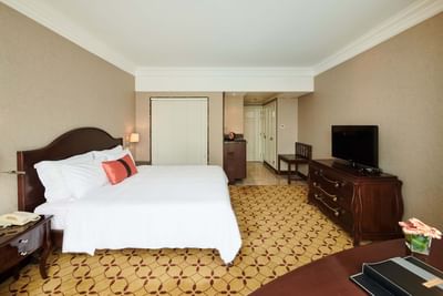 Deluxe Room with a king size bed & a working area at Eastin Grand Hotel Saigon