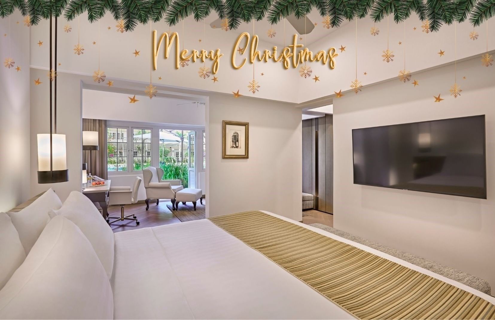 Festive banner with merry christmas text displayed inside Goodwood Park Hotel suite decorated with warm holiday lighting