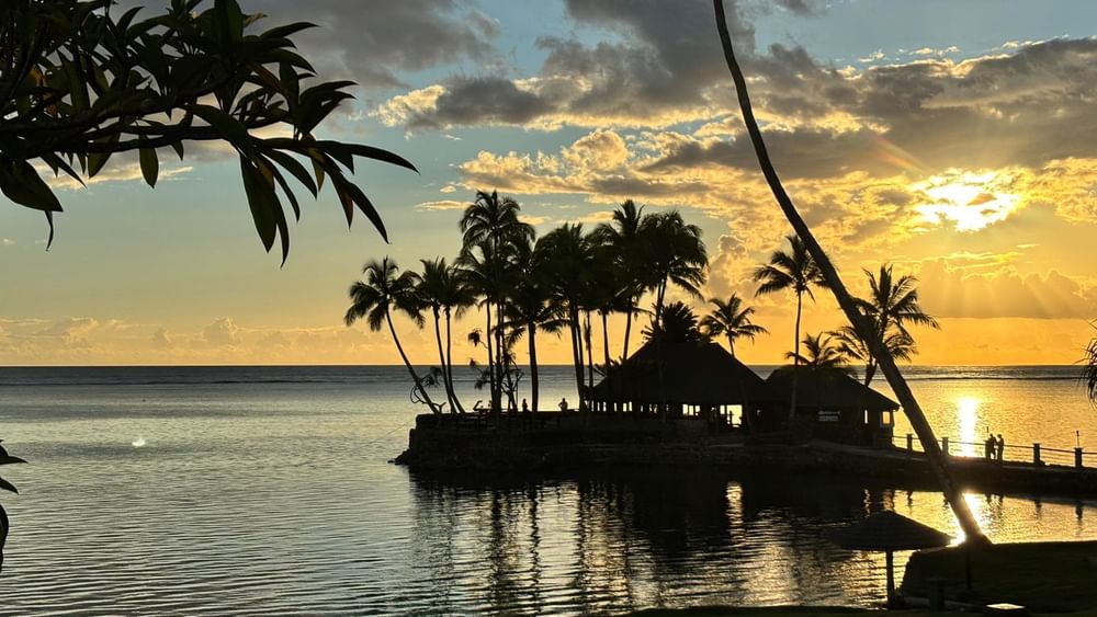 Sunset over ocean view at Wicked Walu restaurant at Warwick Fiji Resort and Spa, Korolevu.