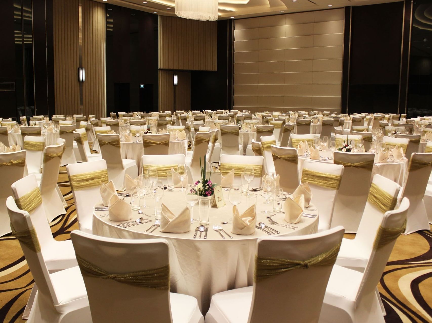 Banquet tables arranged in Ballroom with carpeted floors at Po Hotel Semarang