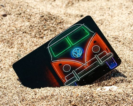 Close-up of Gift Card on sandy beach near Retro Suites Hotel
