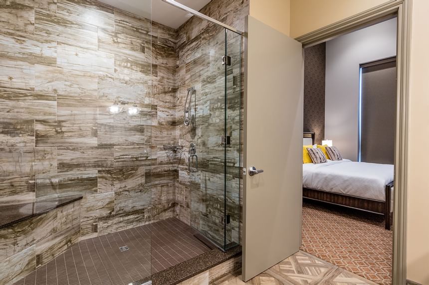 Shower cubicle, marble tiled walls & bathroom interior in King Premier Ranch at Retro Suites Hotel