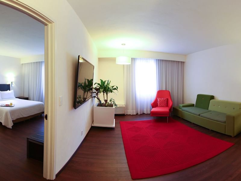 The living area of Junior Suite with lounges at Fiesta Inn