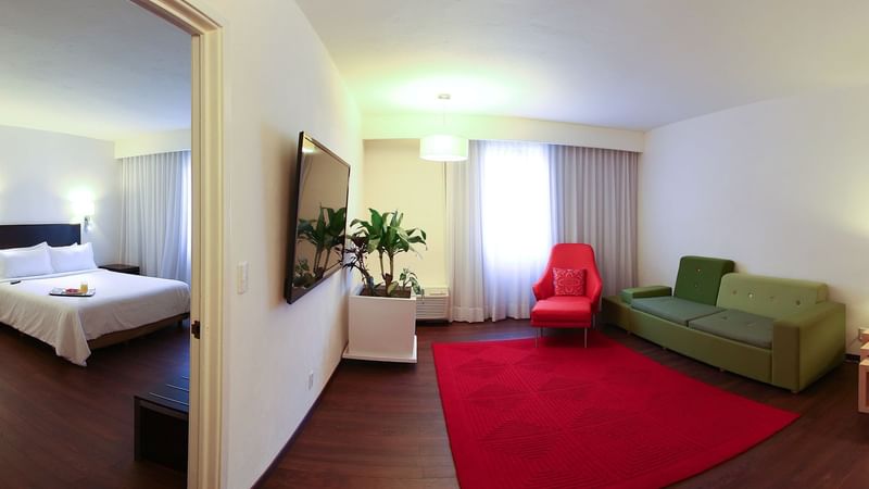 Bedroom & living area in a guest room at Fiesta Inn Xalapa