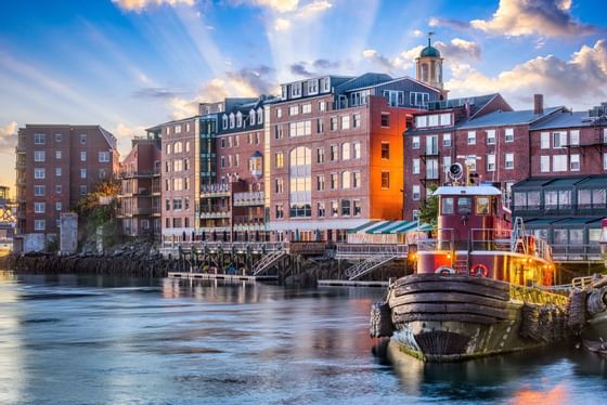 brick building next to water and boat