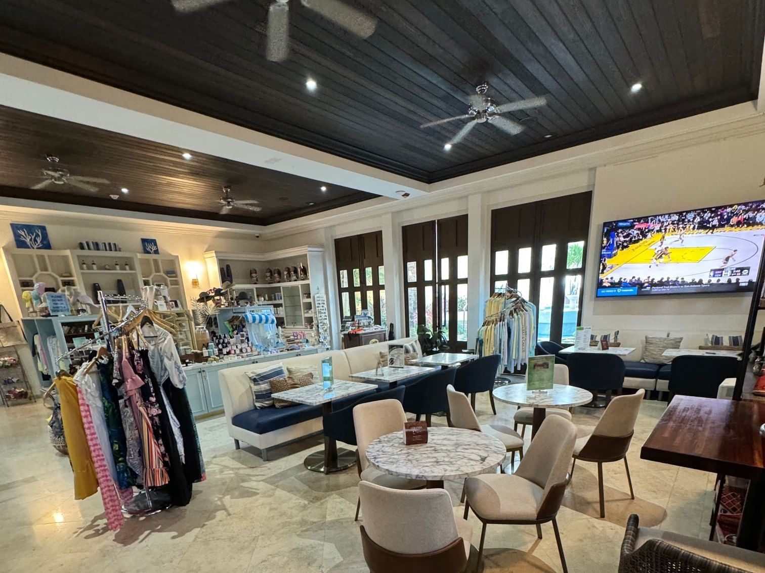 Bright and modern boutique interior with seating area at Veranda Coffee Bar in Windsong Resort On The Reef