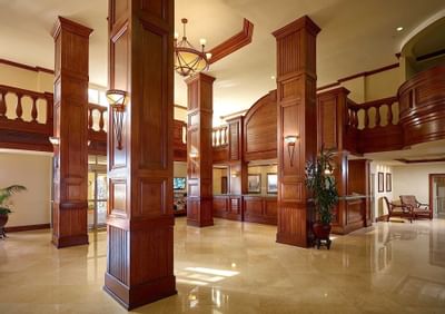 lobby with wooden pillars and reception desk
