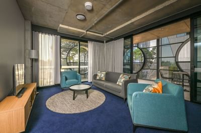 Livingroom area in a hotel suite at Nesuto Curtin Perth Hotel