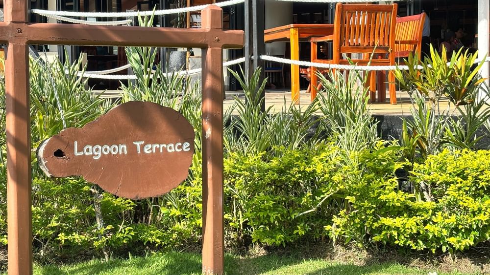 Wooden Lagoon Terrace sign by lush plants at Warwick Le Lagon - Vanuatu, Efate.