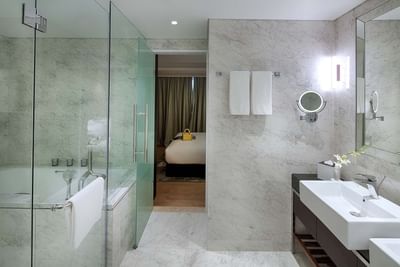 hotel bathroom with marble finishing and double sink