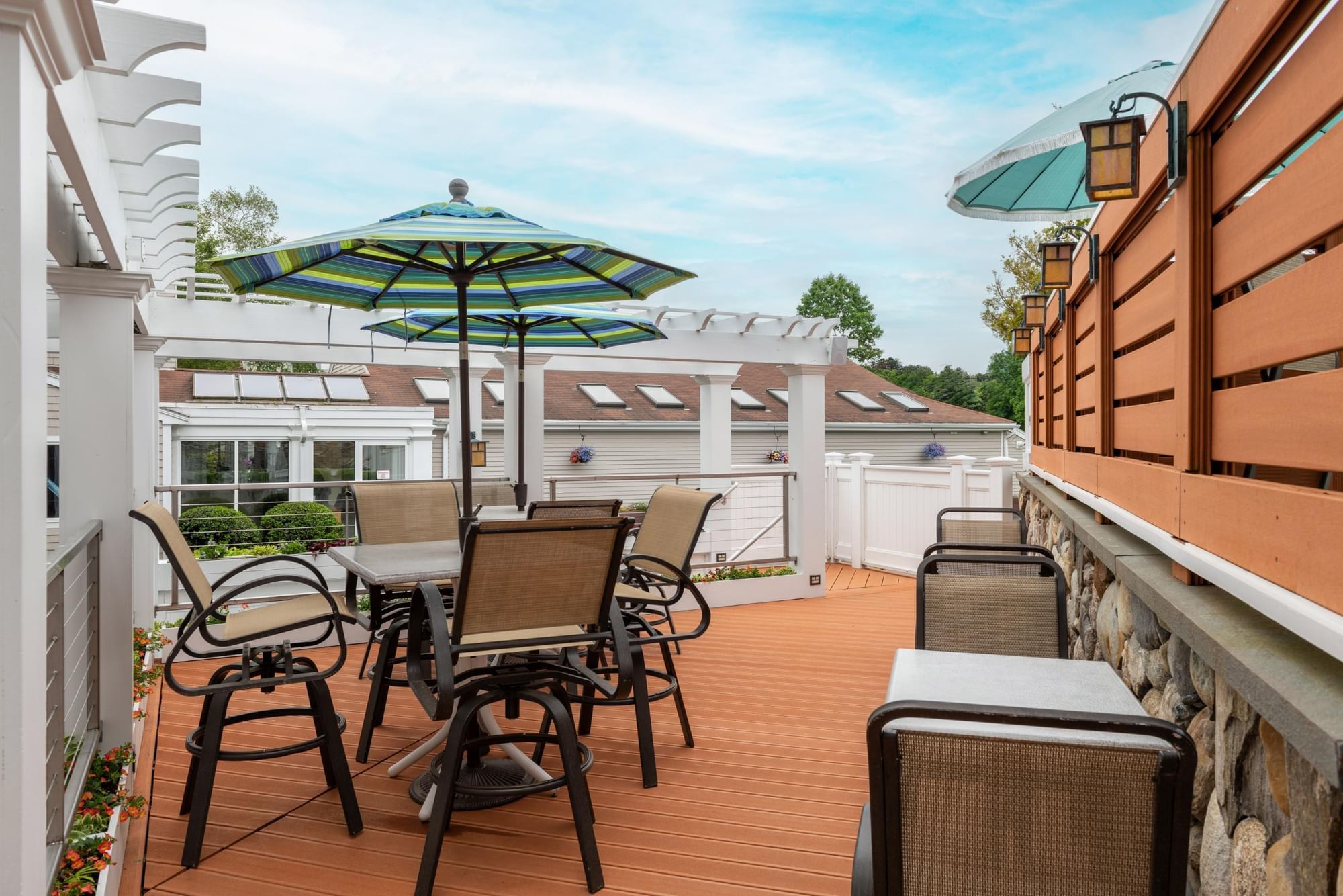 A patio area with outdoor furniture and umbrellas