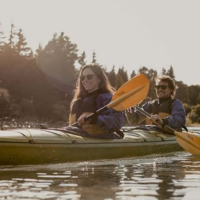 Couple Kayaking at the lake near DOT Hotels