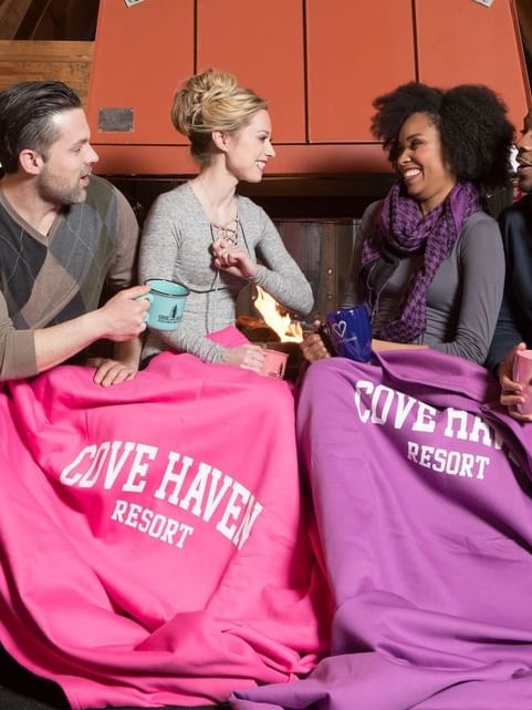 Couples bonding over a discussion and warm beverages at Cove Pocono Resorts